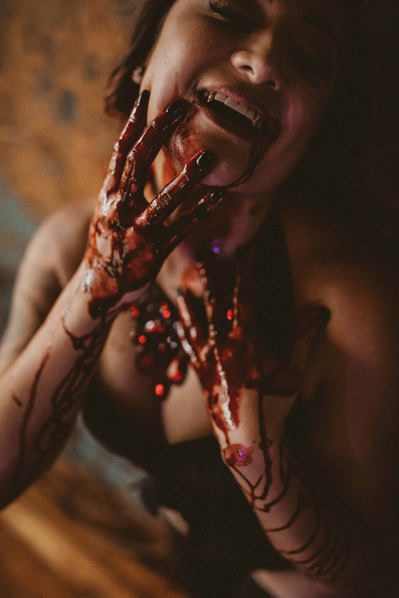 woman halloween make up with blood stain in her hands