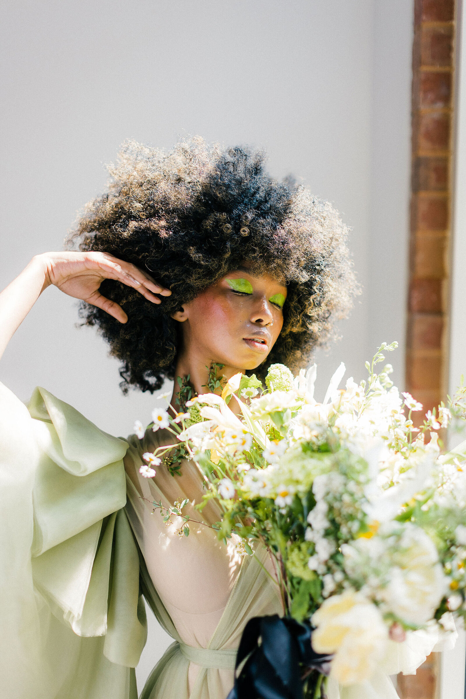 Loose, garden-style bridal bouquet with seasonal blooms and unique textures. Designed by The Floral Eclectic for a spring wedding.