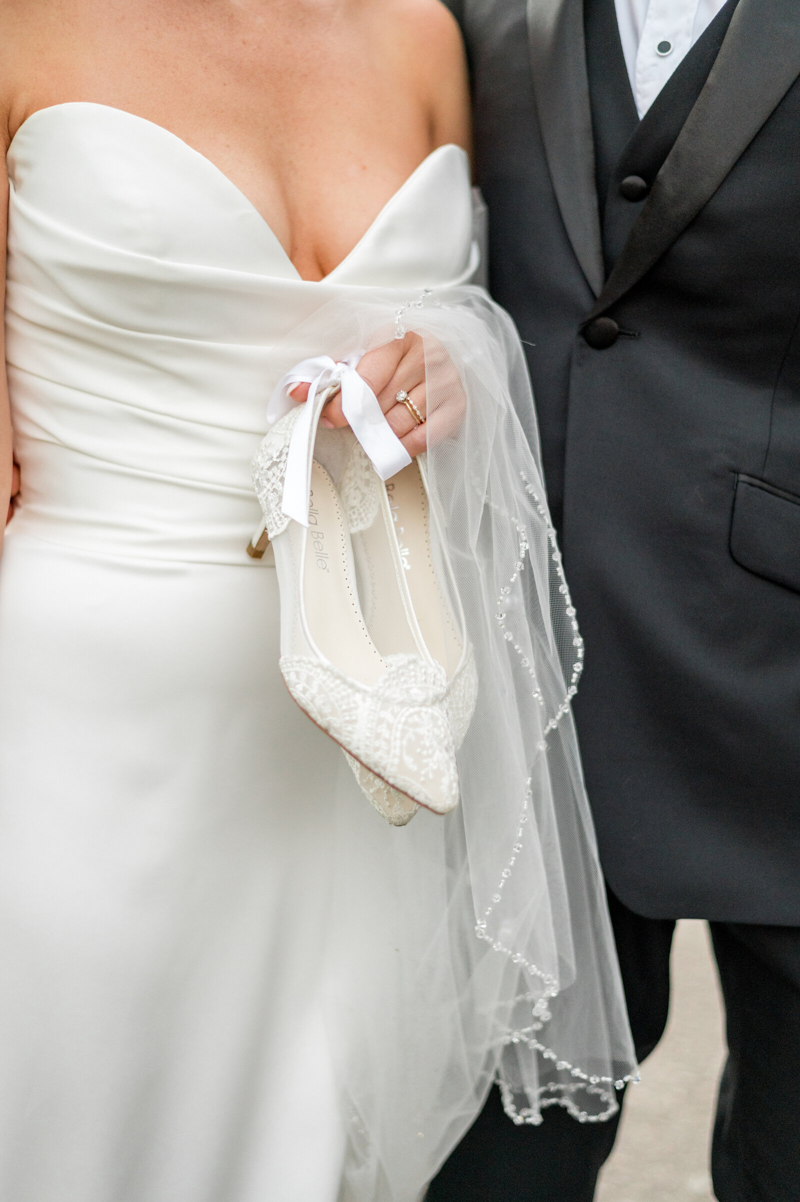 Boston Bride holding her Bella Belle shoes