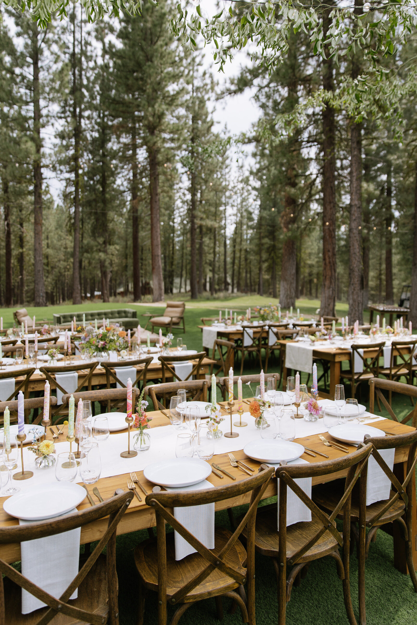 Vintage, retro-inspired wedding table with colorful florals in Lake Tahoe forest