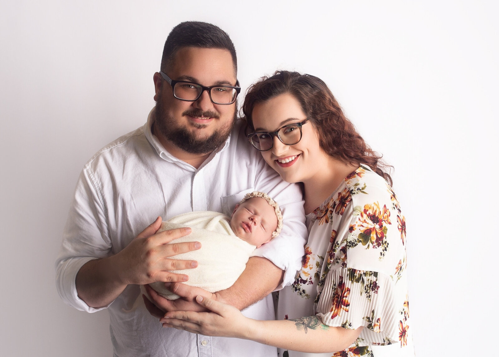 Mom and dad holding newborn baby during newborn photoshoot with Nashville Tennessee newborn photographer