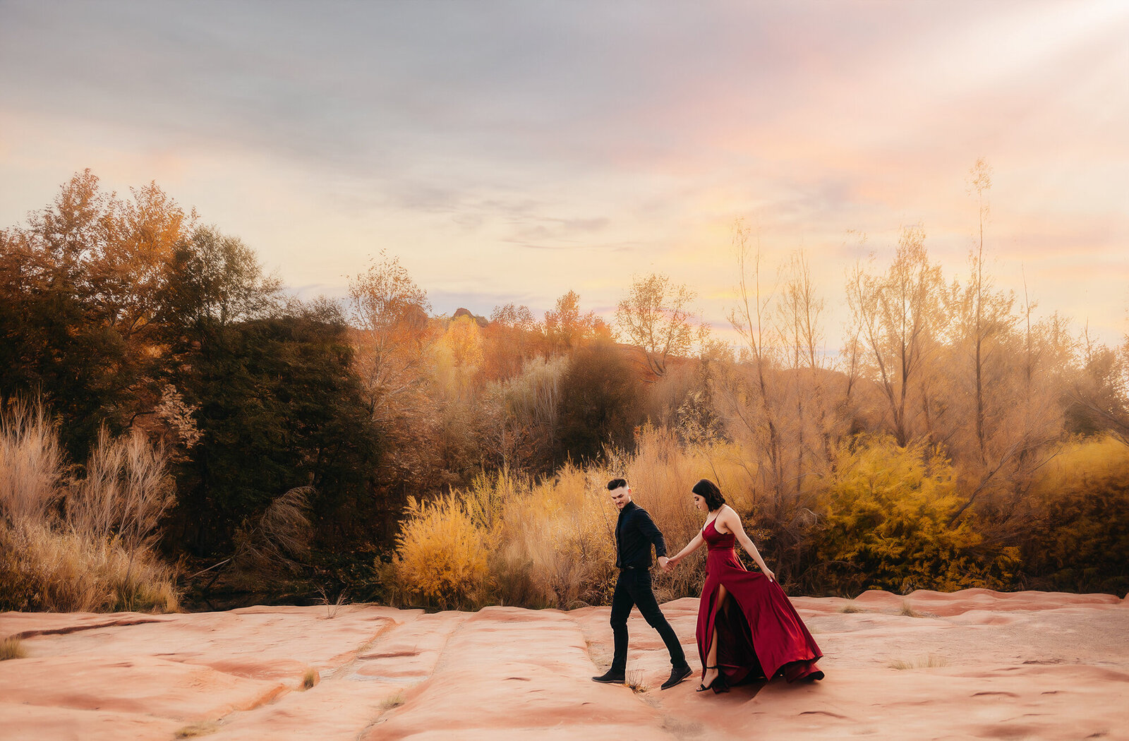 Engaged couple poses for Engagement Photos at Crescent Moon Ranch in Sedona Arizona.