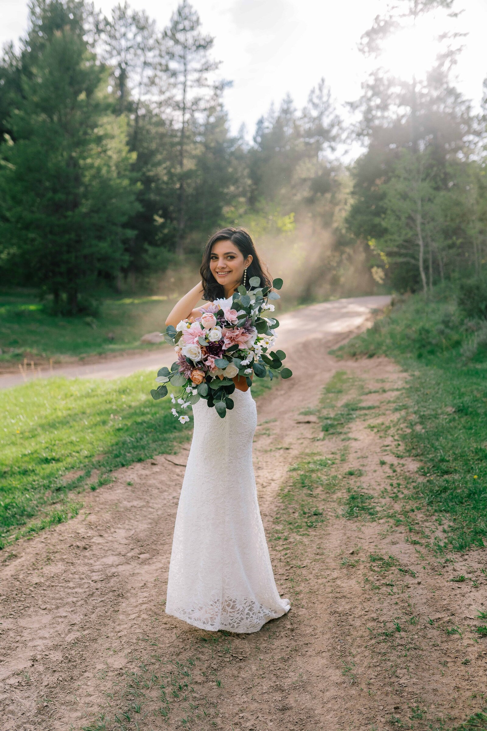 Lake Tahoe wedding photographer captures forest bridals with bride holding bouquet