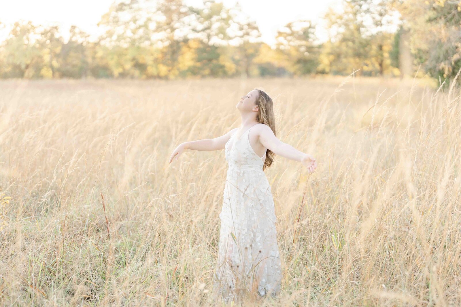 high school girl enjoy the wind during Loudoun County, Virginia senior photography