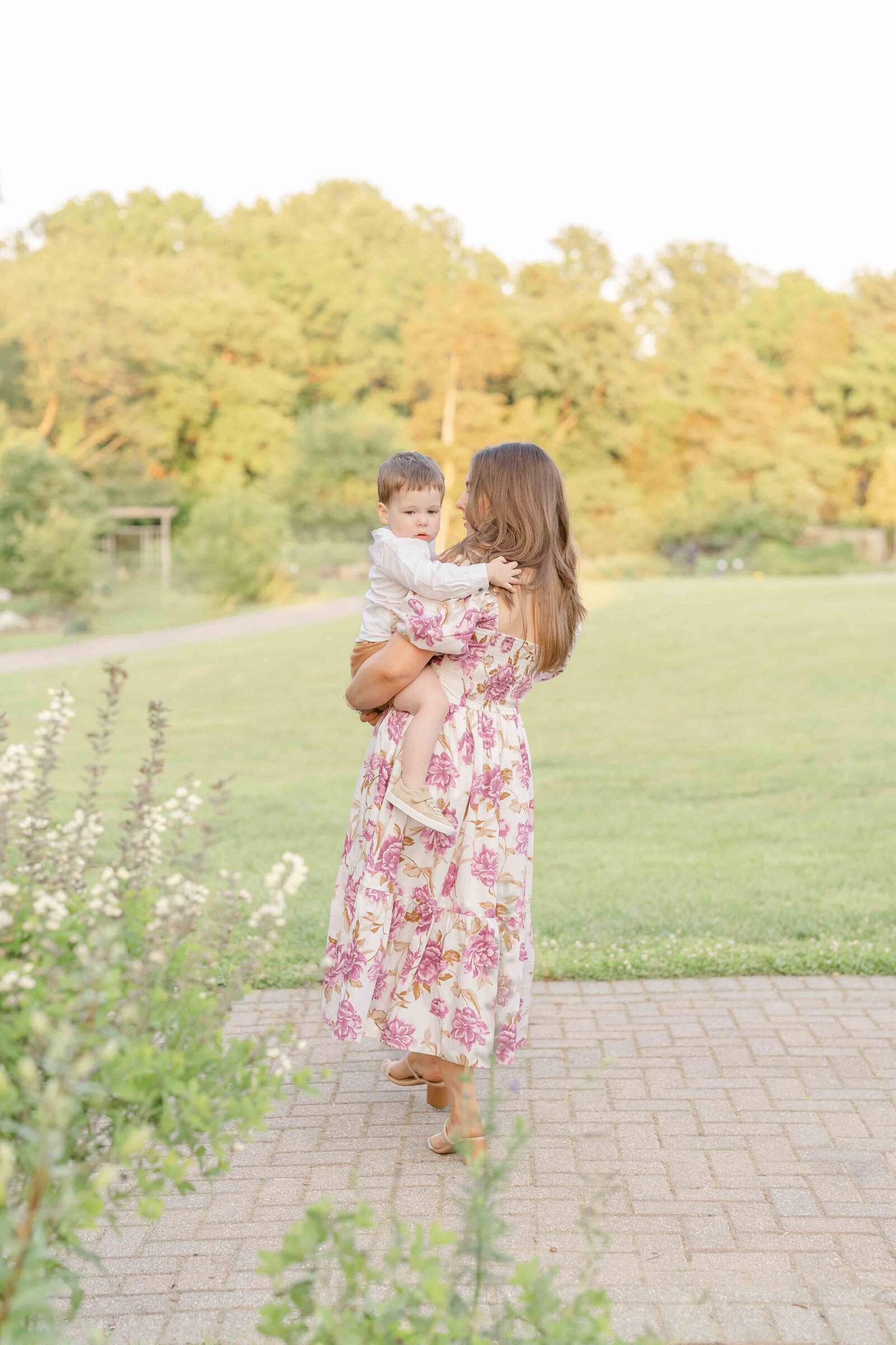 mom walking with son in Chantilly, Virginia spring minis
