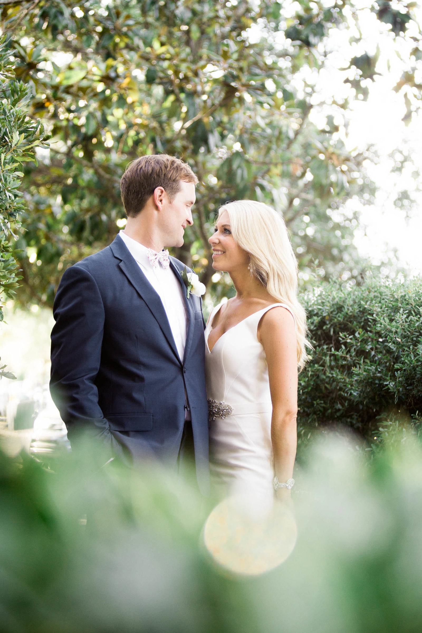 Bride and groom snuggle at the Rice Mill Building, Charleston, South Carolina