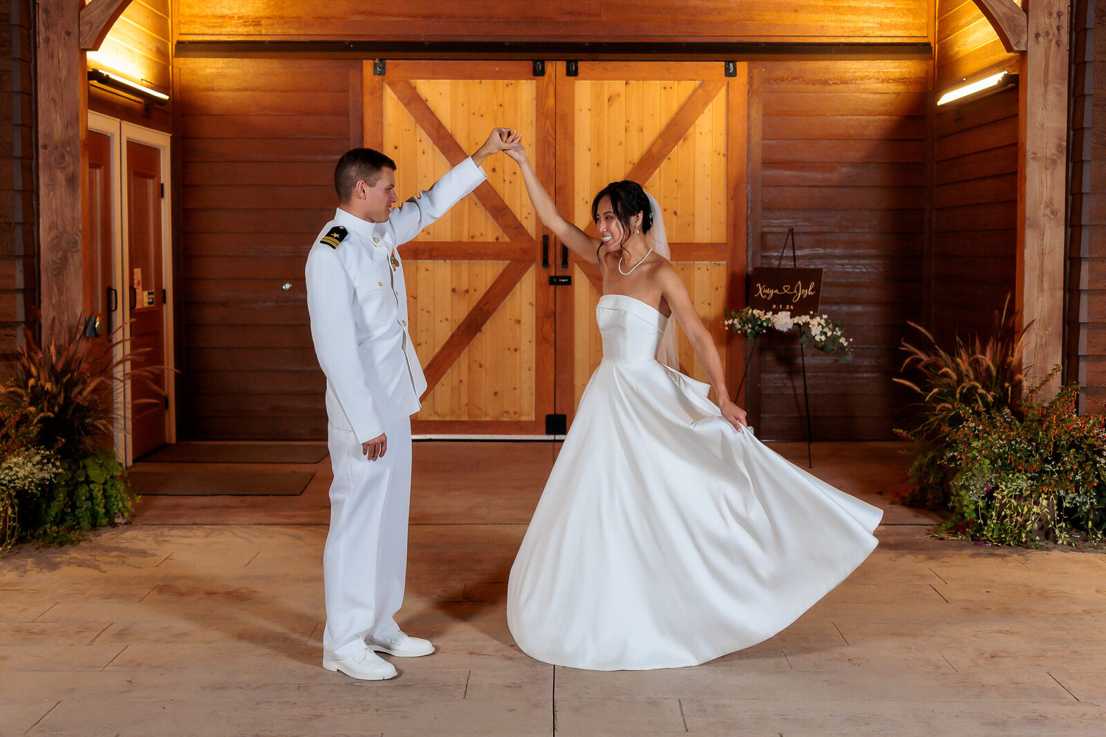 bride and groom swaying inside the barn at barnwood events in madison, winconsin