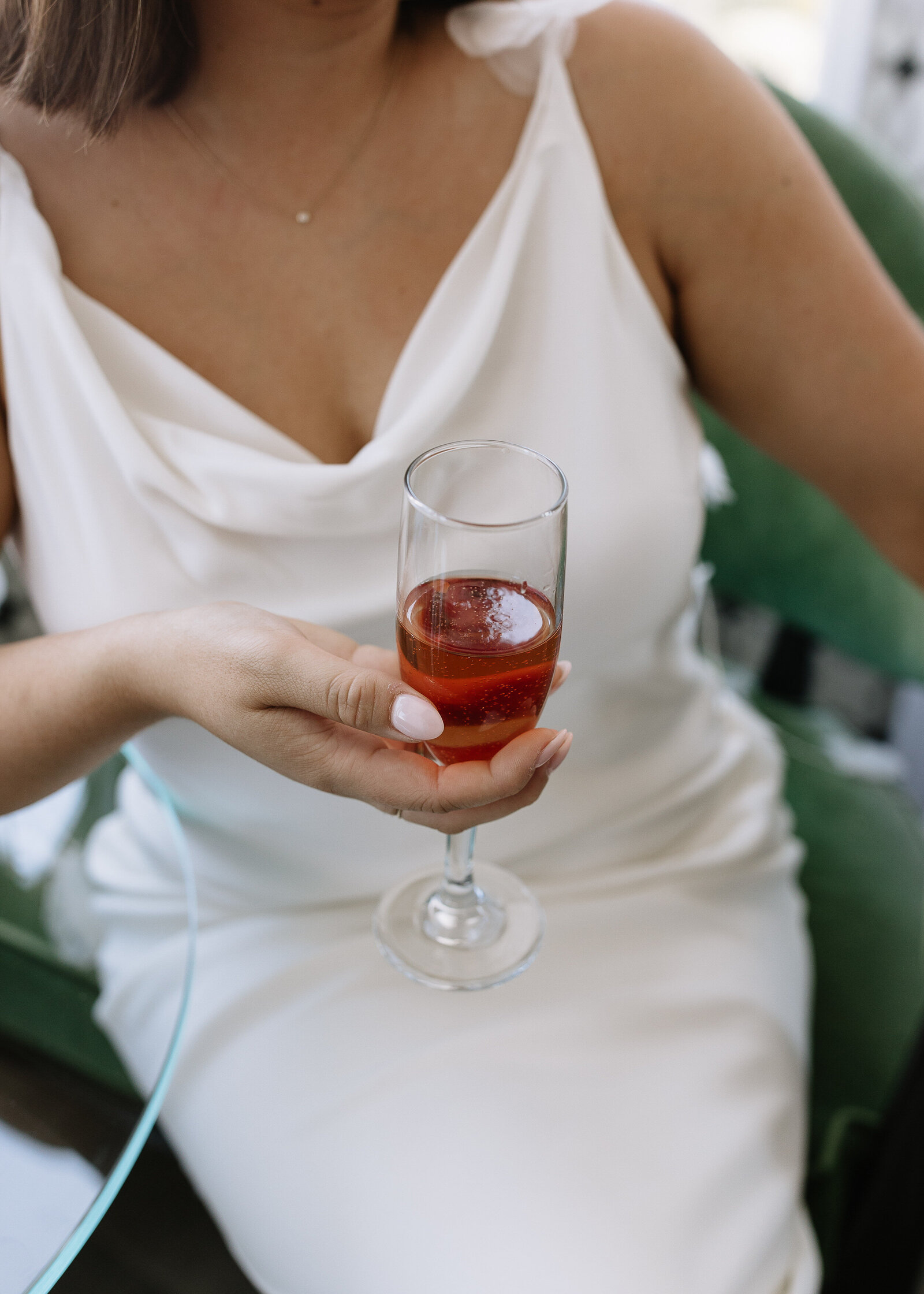 Bride holding champagne glass taken by best Northern California wedding photographers