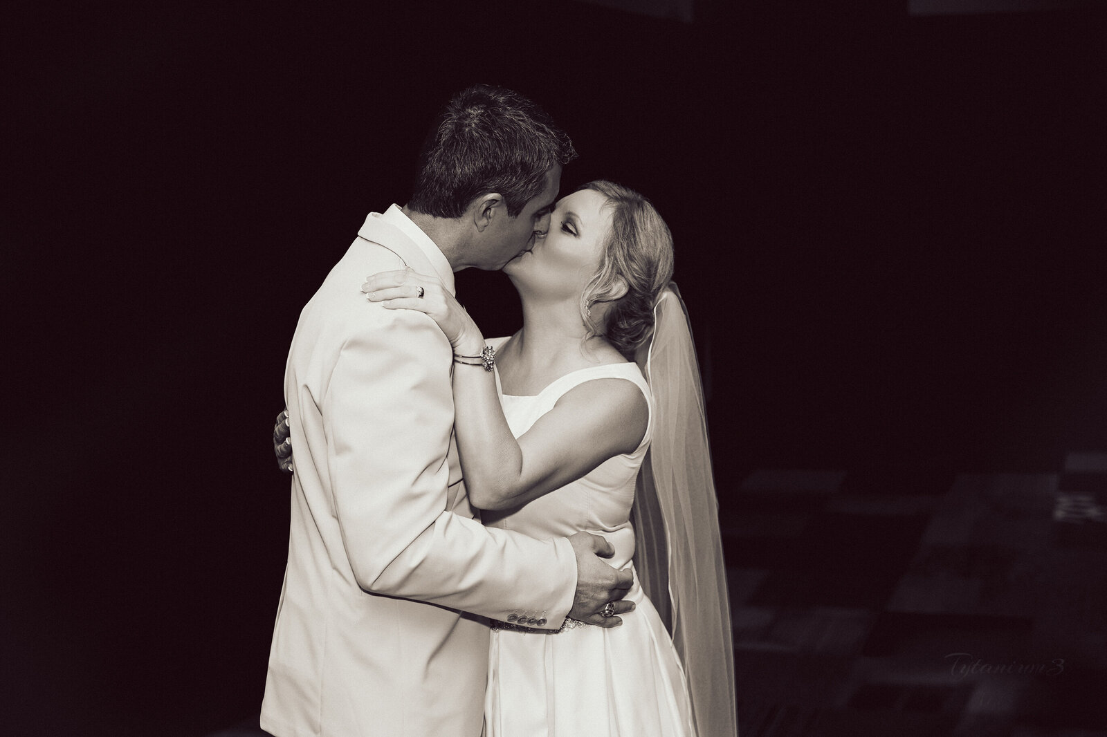 first kiss after wedding in blacka nd white