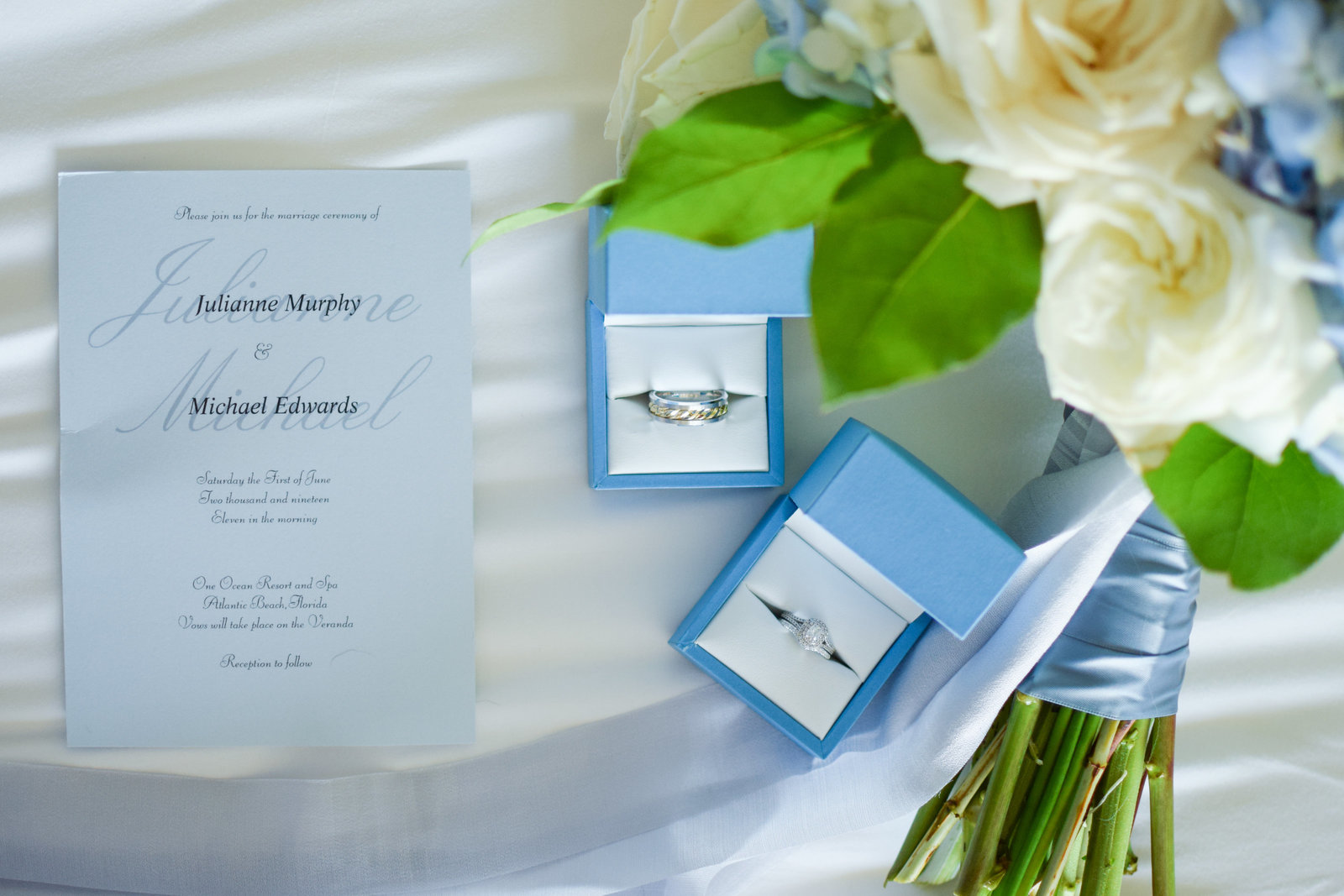 Wedding blue ring boxes and bouquet One Ocean Resort Jacksonville Florida