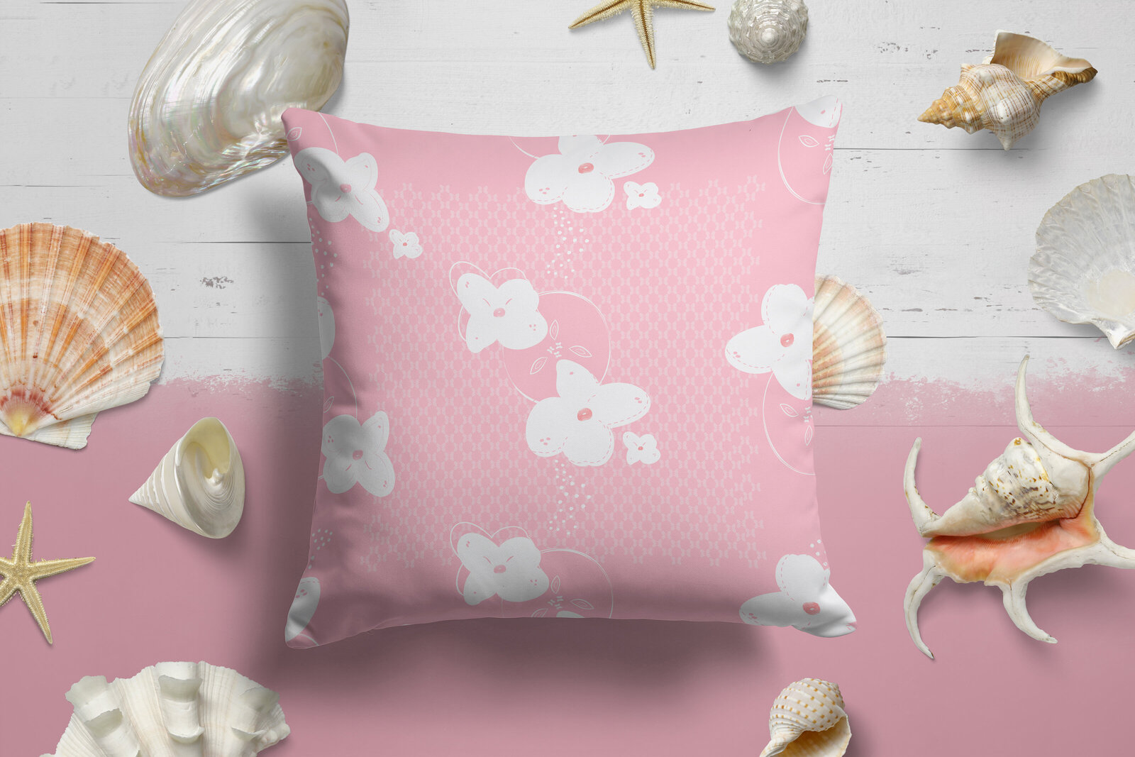 pink and white floral patterned pillow