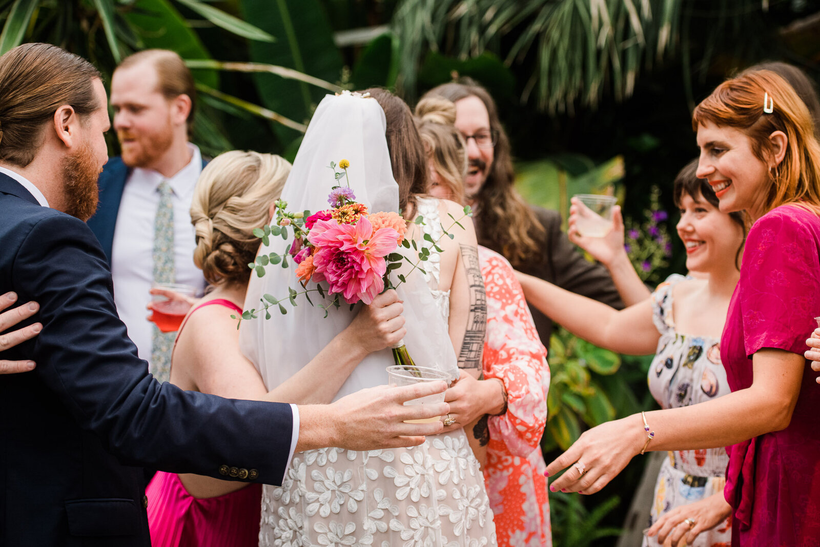 friends hug bride 