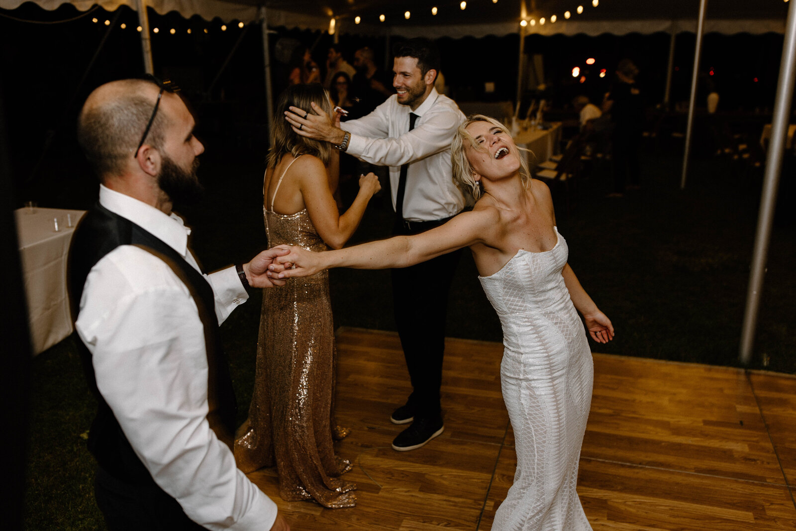 bride and groom holding hands and singing during baltimore maryland wedding reception