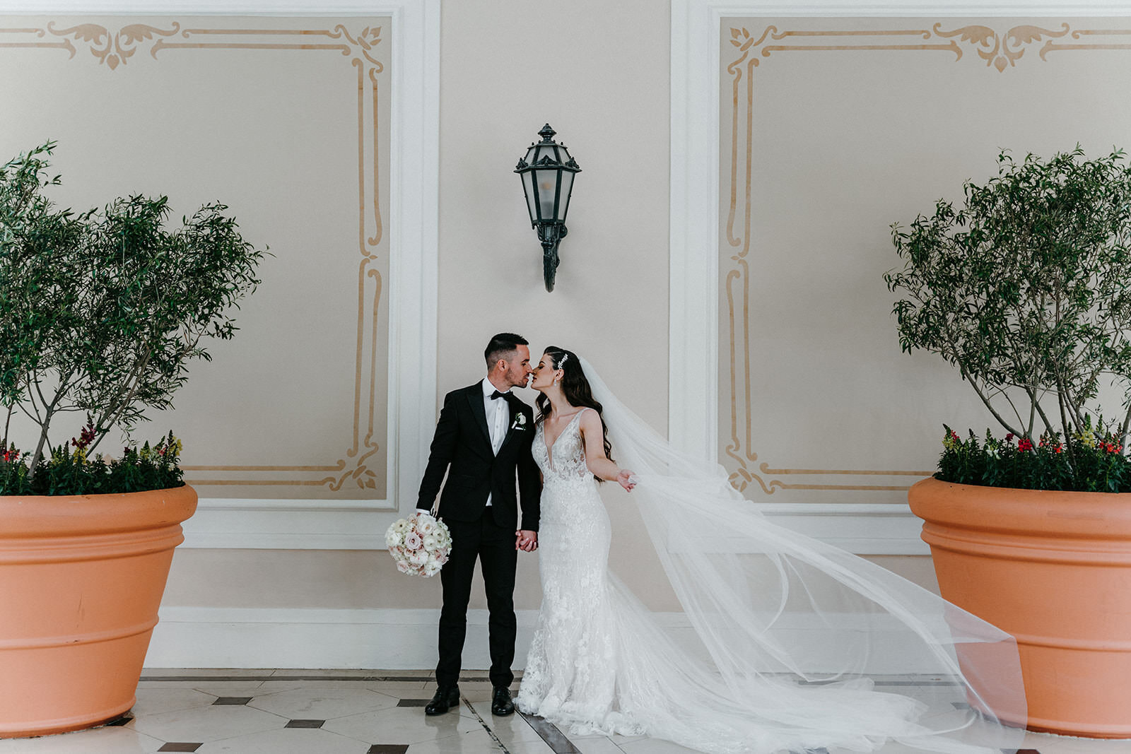 Bride and groom kissing at  Bellagio Hotel & Casino in Las Vegas
