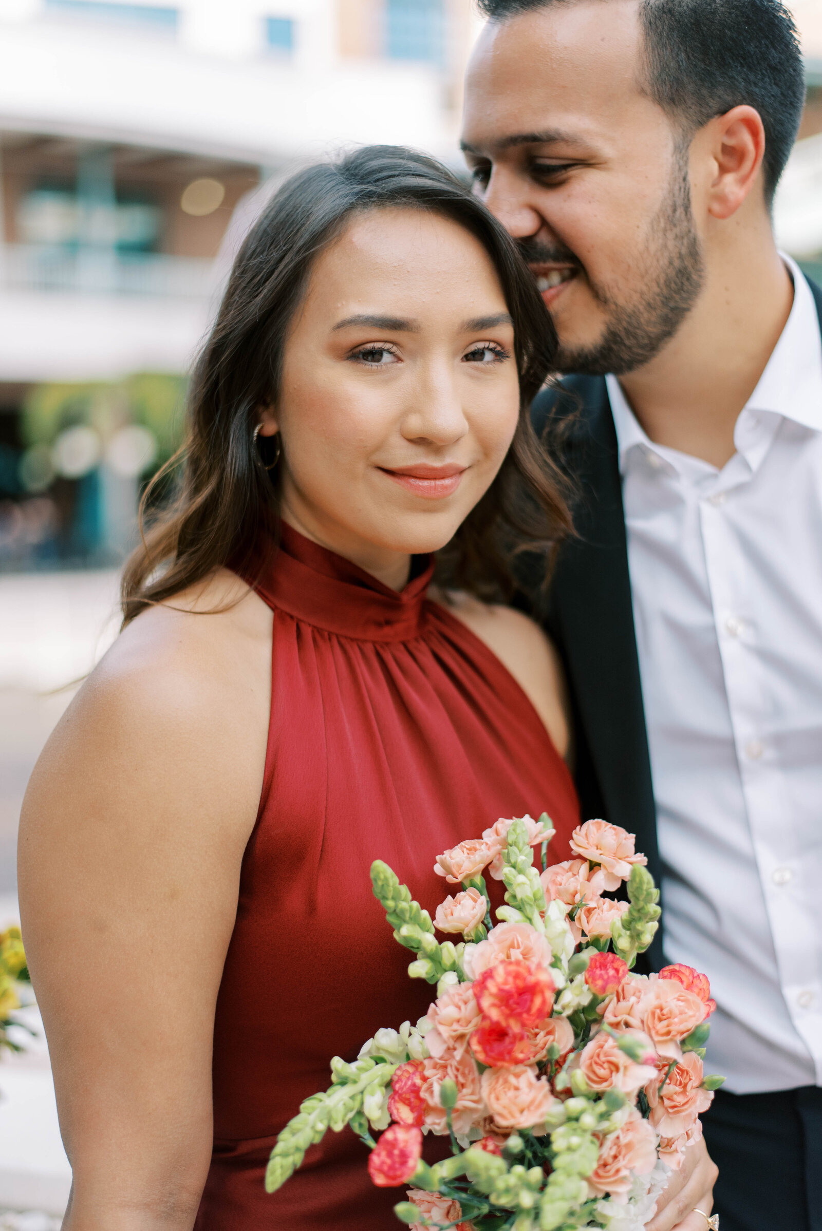 couple smiling during outdoor engagement session