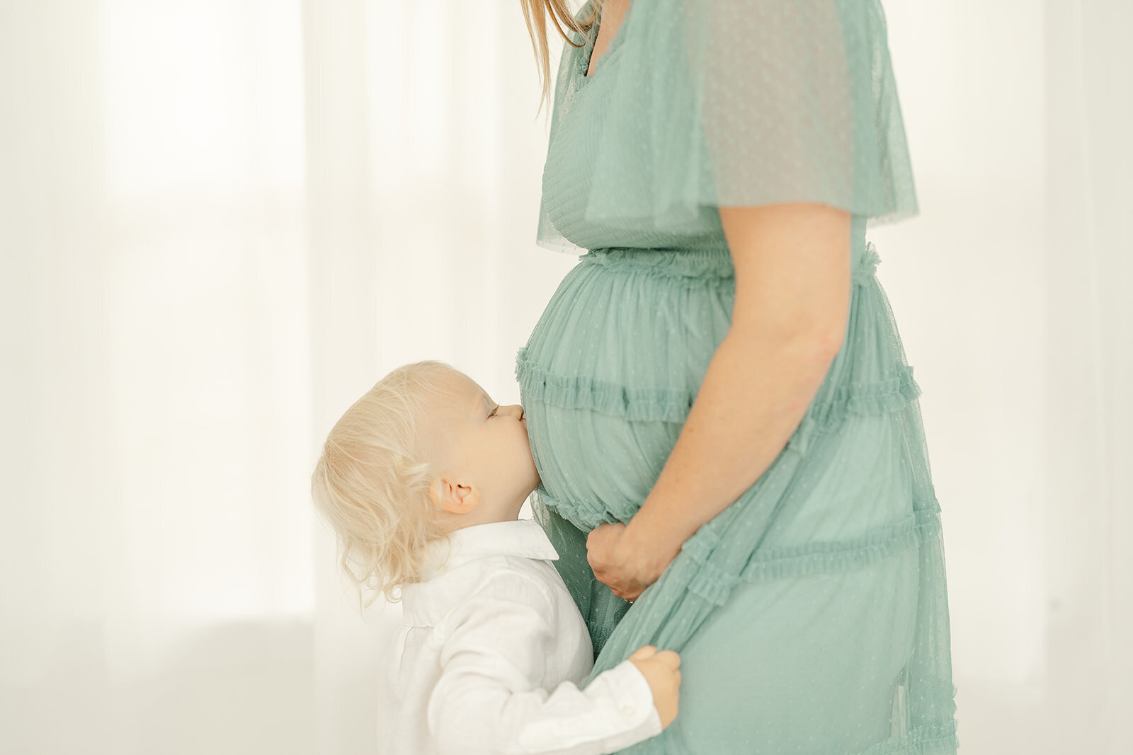 big brother kissing mom's belly during Prince William County, VA maternity session