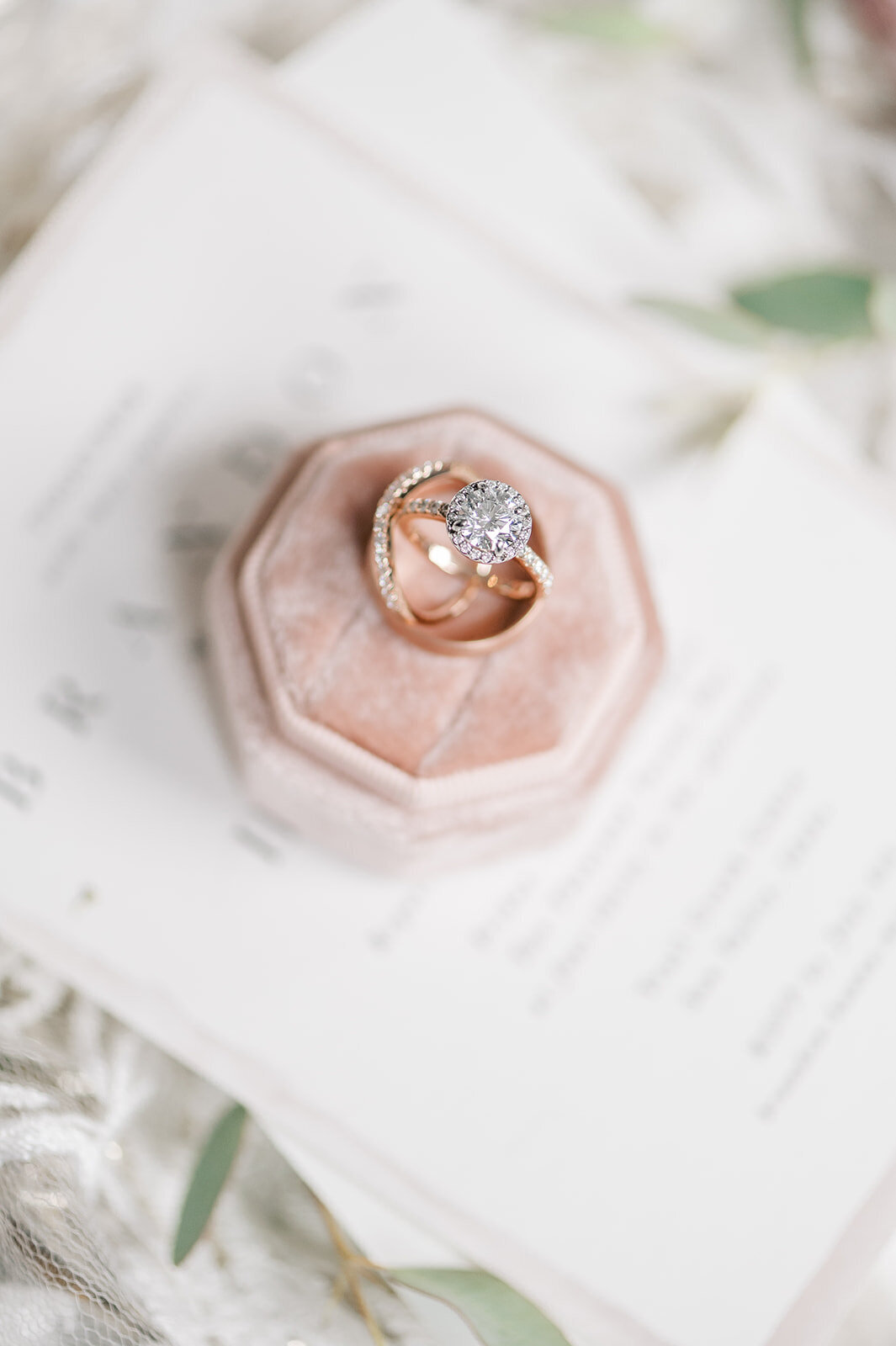 Wedding rings and velvet pink ring box at Trail Creek Cabin Wedding taken by the Best Sun Valley Wedding Photographers