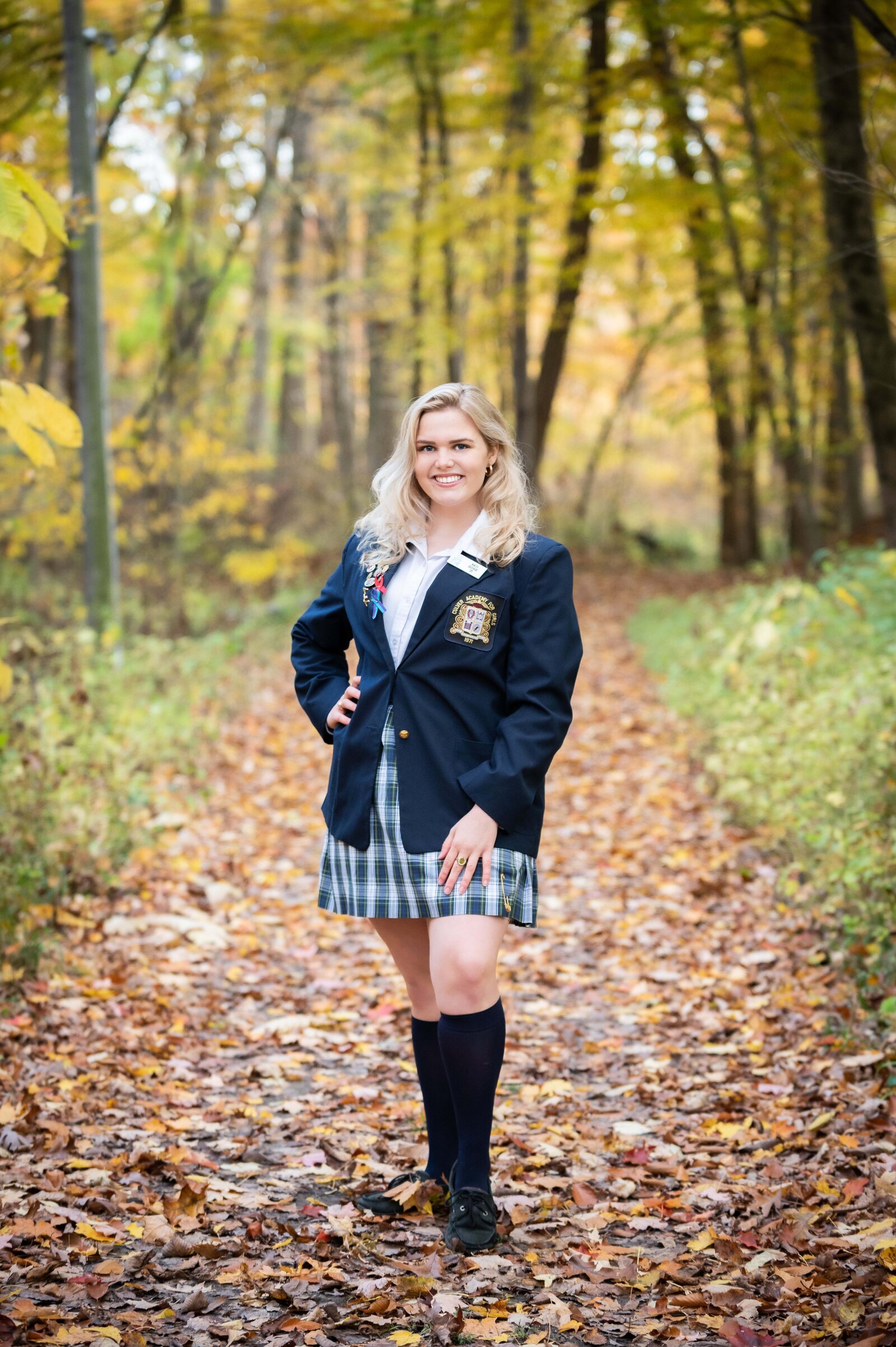 Culver Girls Academy Senior picture of girl in fall woods with changing leaves