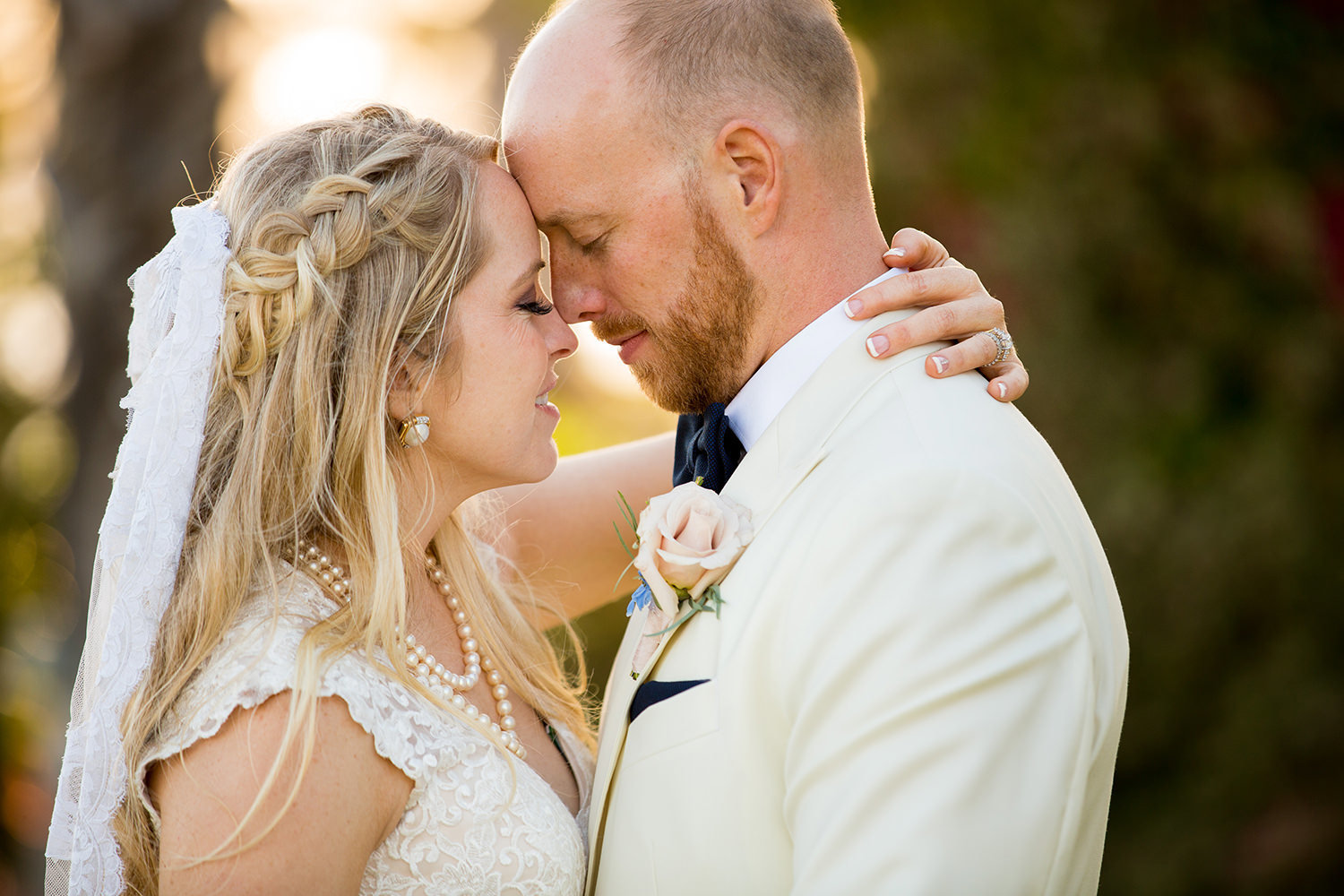 Sweet moment captured in a portrait of the bride and groom