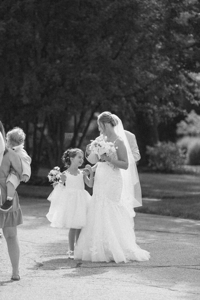 bride hugging flower girl