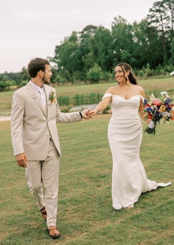 Bride-Groom-Holding-Hands-The-Legacy-at-Willow-Pond.JPG