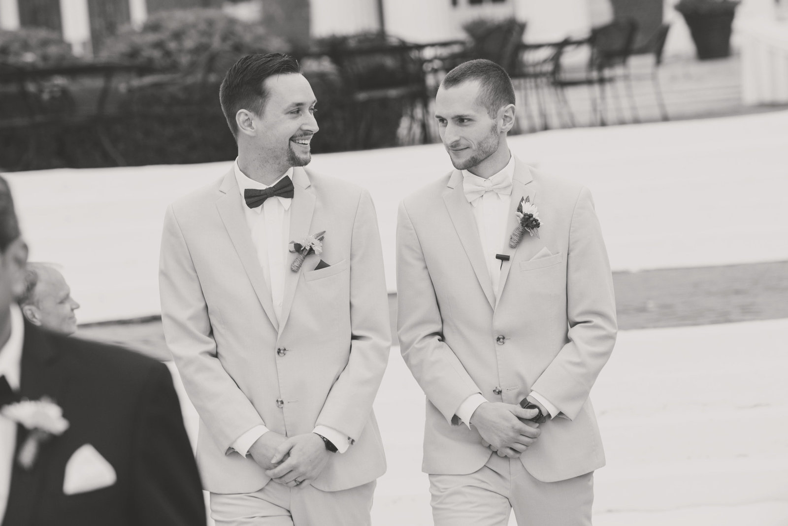 Groom and best man walking down the aisle at the Bourne Mansion