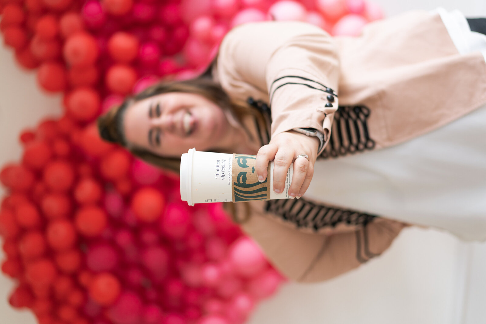 Houston's best wedding photographers Swish and Click drinks a Starbucks coffee