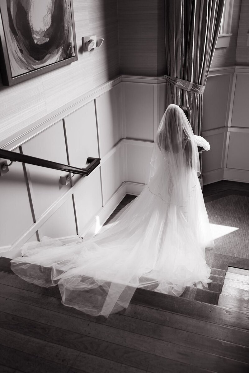 bride walking down stairs at wedding  designed by New Jersey wedding planners