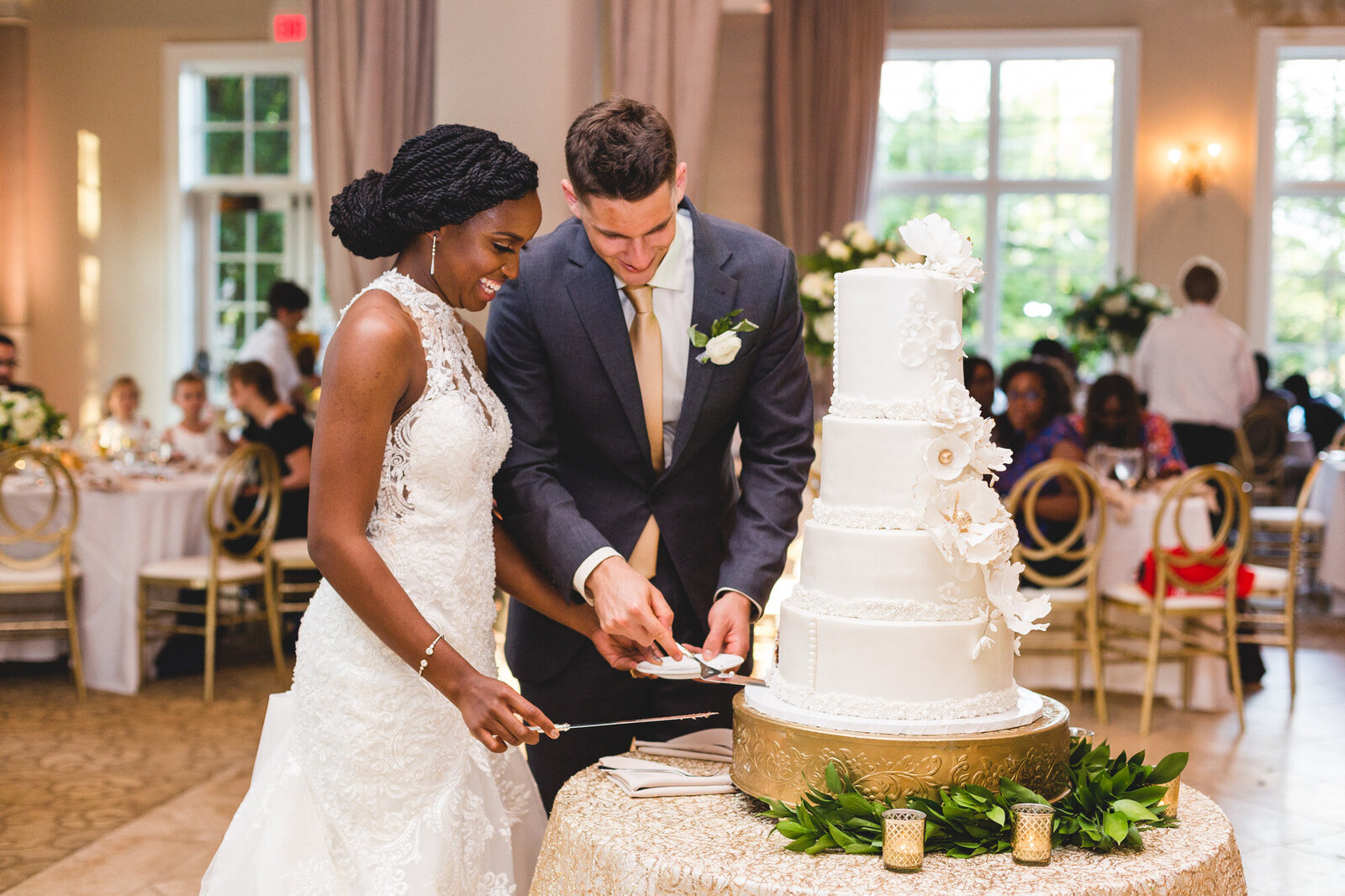 couple cutting cake at wedding day photographer ohio