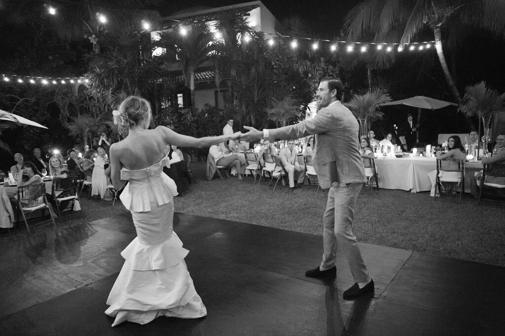 Bride and groom first dance at wedding reception at Guests enjoying wedding reception at Hotel Esencia