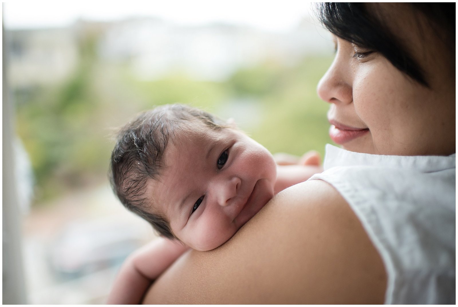 Newborn baby on mom's shoulder lifestyle Emily Ann Photography Seattle Area Photographer.