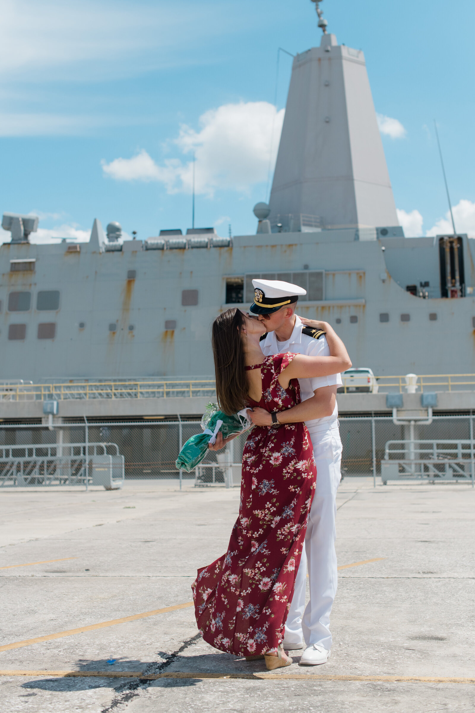 Couple embraces after long Navy deployment at homecoming