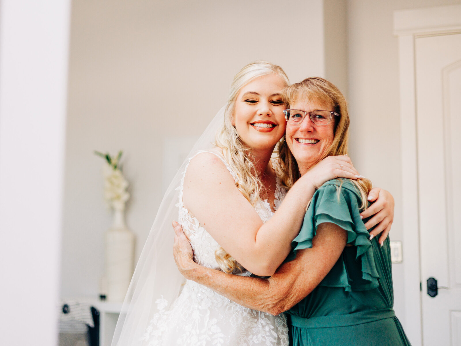 Bride hugs mom in Bridal suite at Diamond Barrel