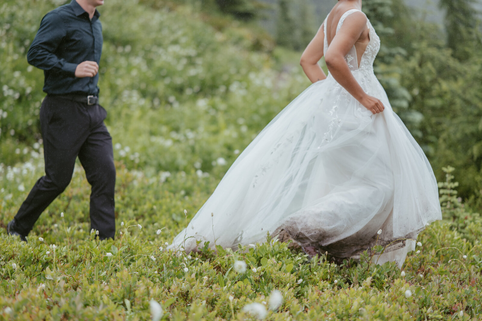 Elopement couple play tag game and chasing after each other
