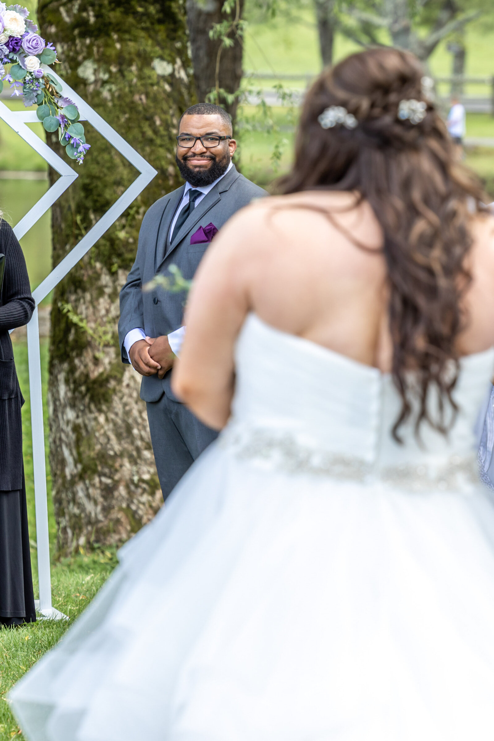 Groom's emotional reaction as he sees his bride walking down the aisle during their wedding ceremony at Chetola Resort in Blowing Rock NC.