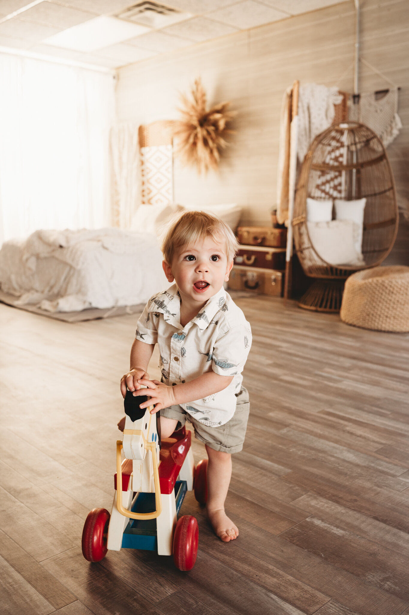 Embracing the chaos of a little ones milestone session. Nikii incorporates fun and classic toys to distract littles and to create lasting memories of laughter and smiles. 