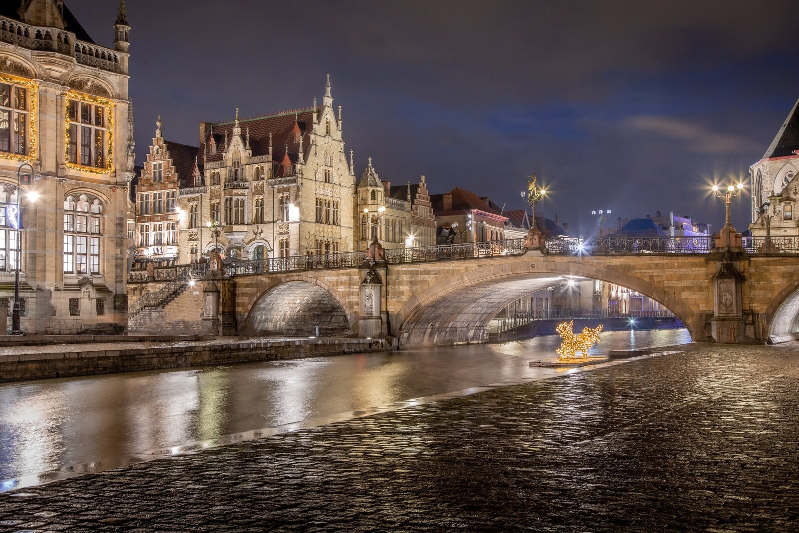 Illuminated St. Michael's Bridge in Ghent Belgium at night