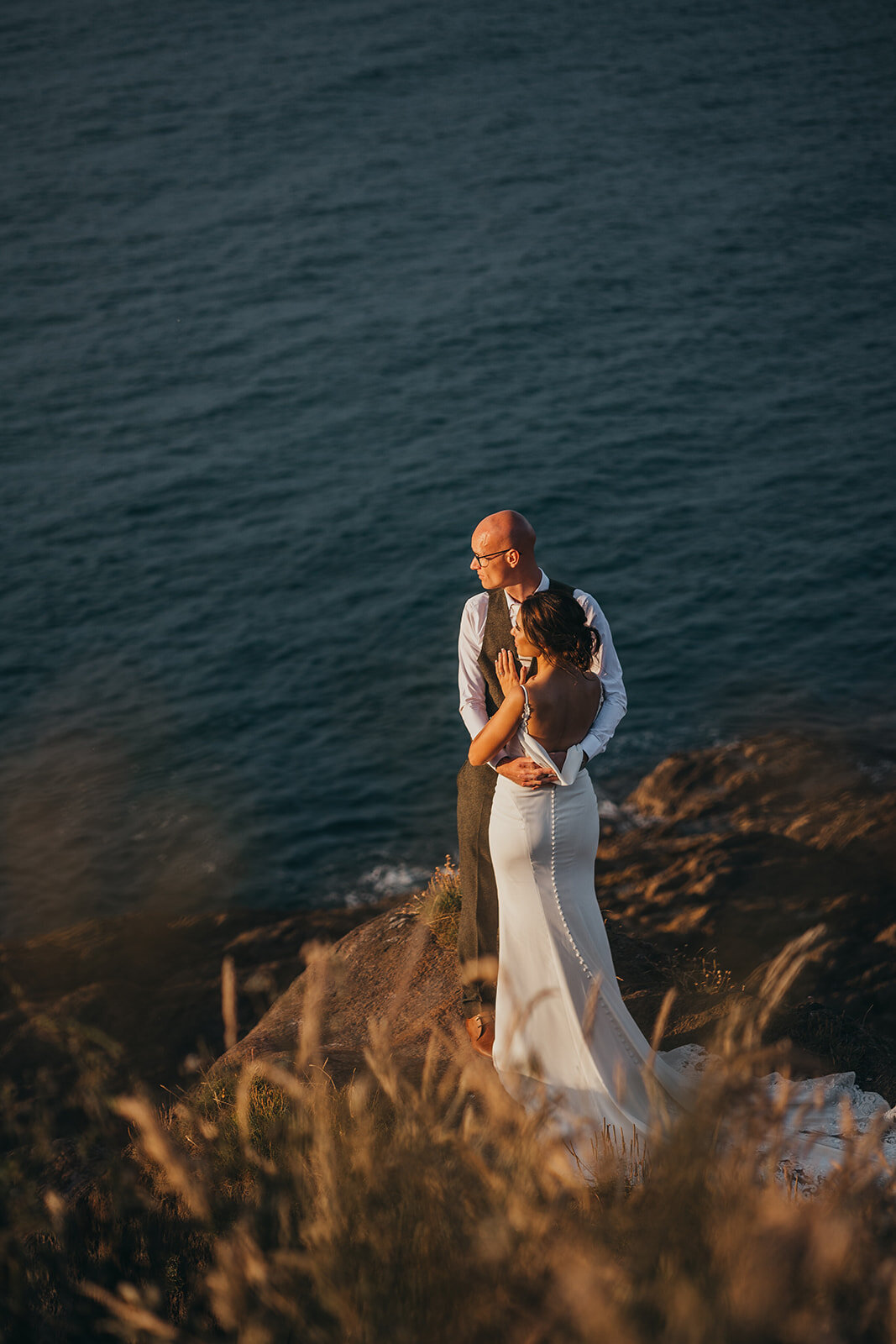 married couple look out to sea