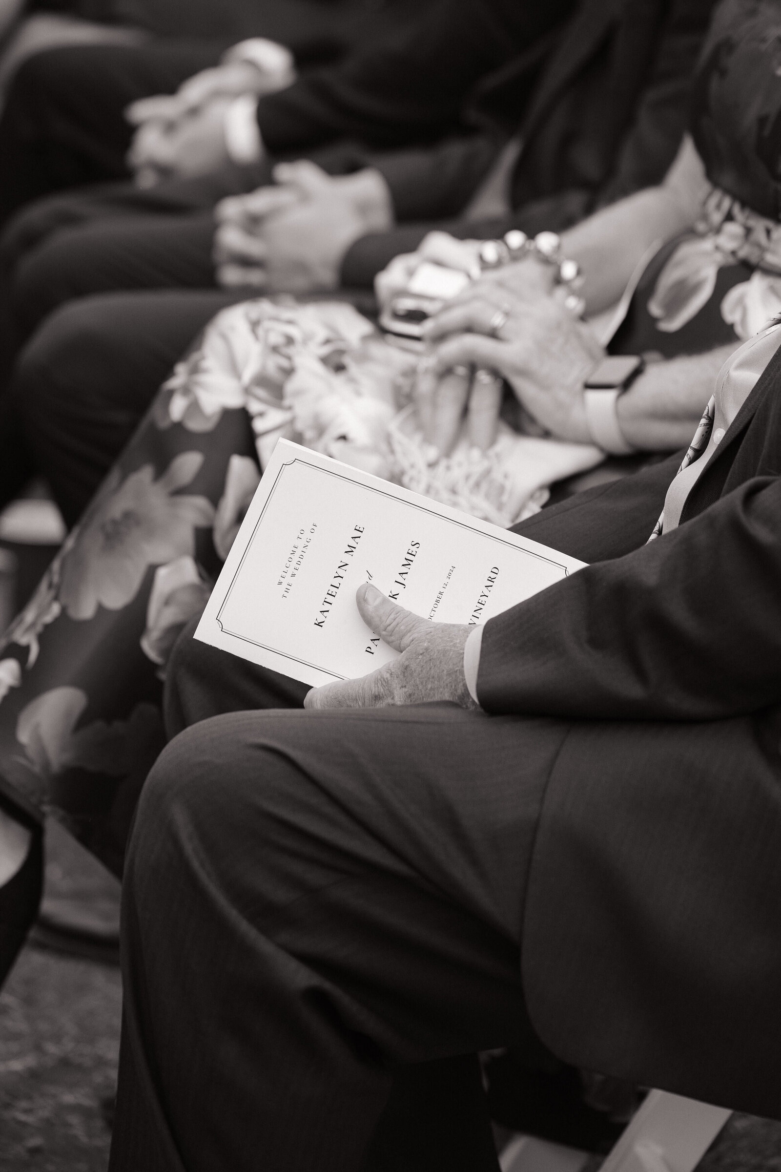 Guest holding wedding program by Washington elopement photographer
