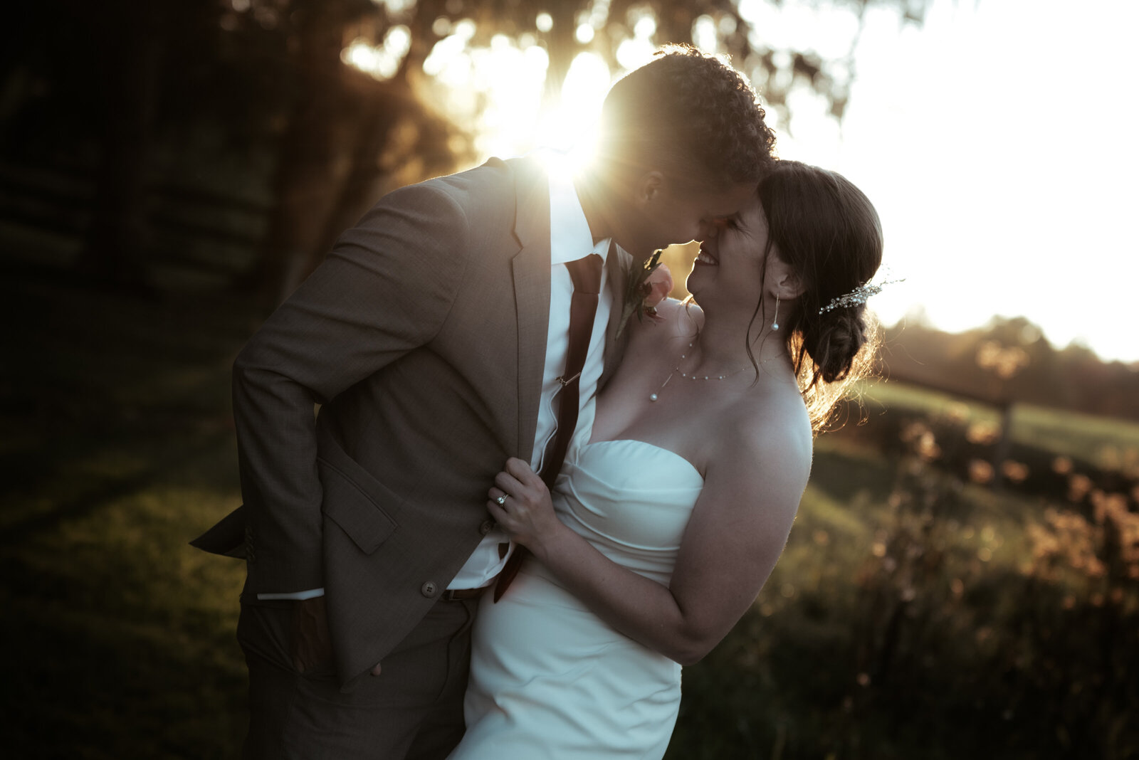 A couple sneaks away from their reception for golden hour portraits on a farm in rural Pennsylvania.