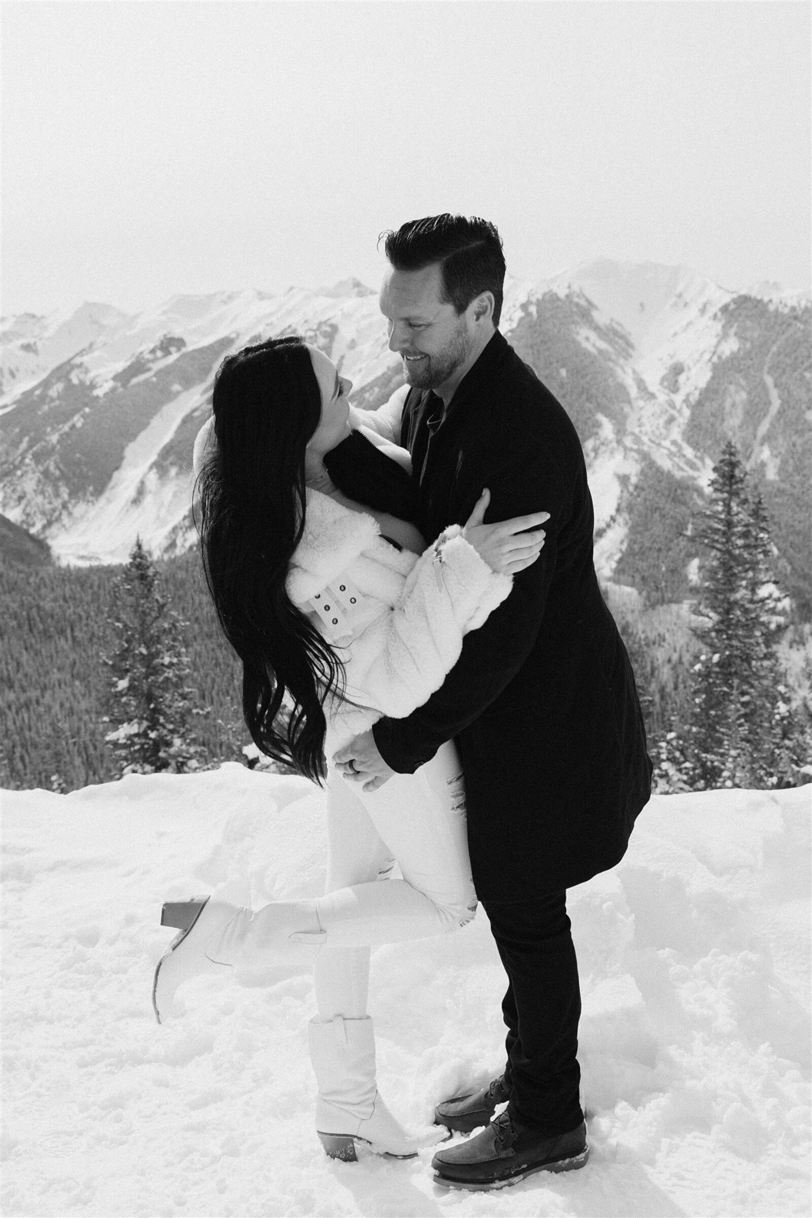 Fashion-forward winter engagement outfits in Aspen, Colorado
