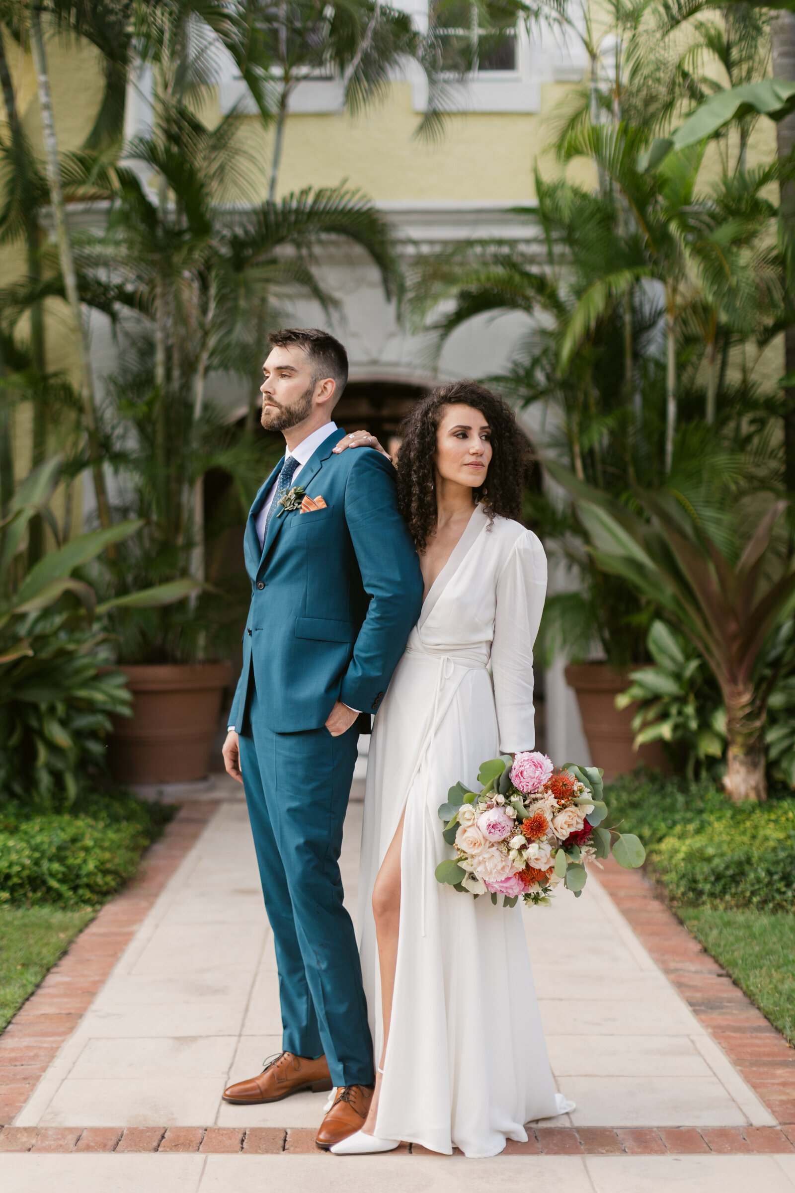 Couple posing at the Brazilian Court in Palm Beach, Florida. Photography by Maggie Alvarez Photography