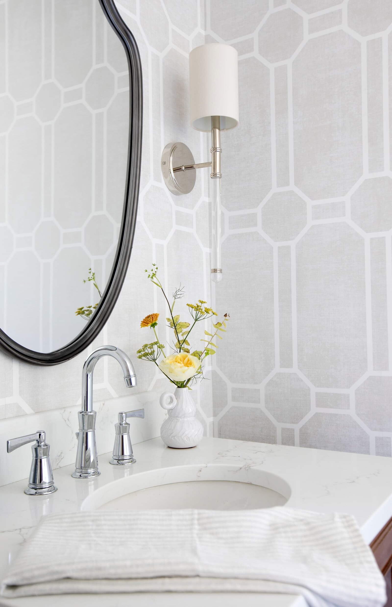 Granville Street l Powder Room with Wallpaper l Detail of Chrome Faucet and Bud Vase of Garden Rose with Greenery