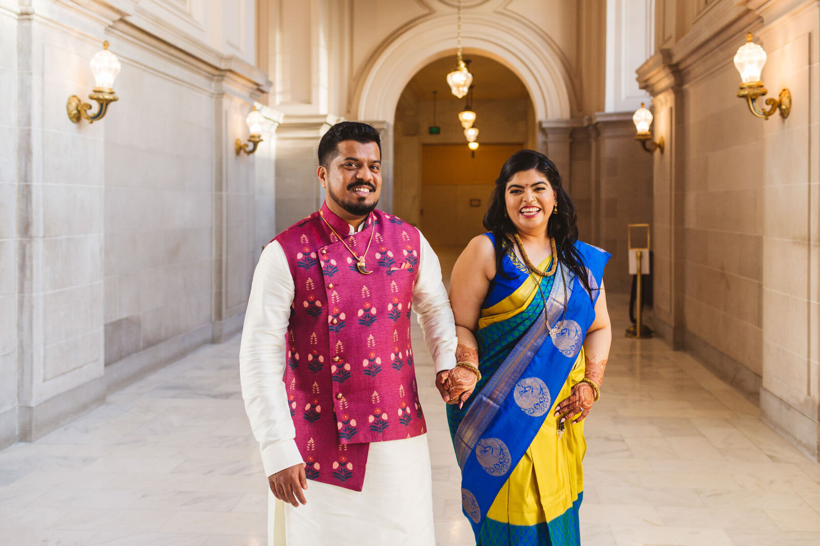 indian wedding couple walk on 4th Floor of San Francisco City Hall