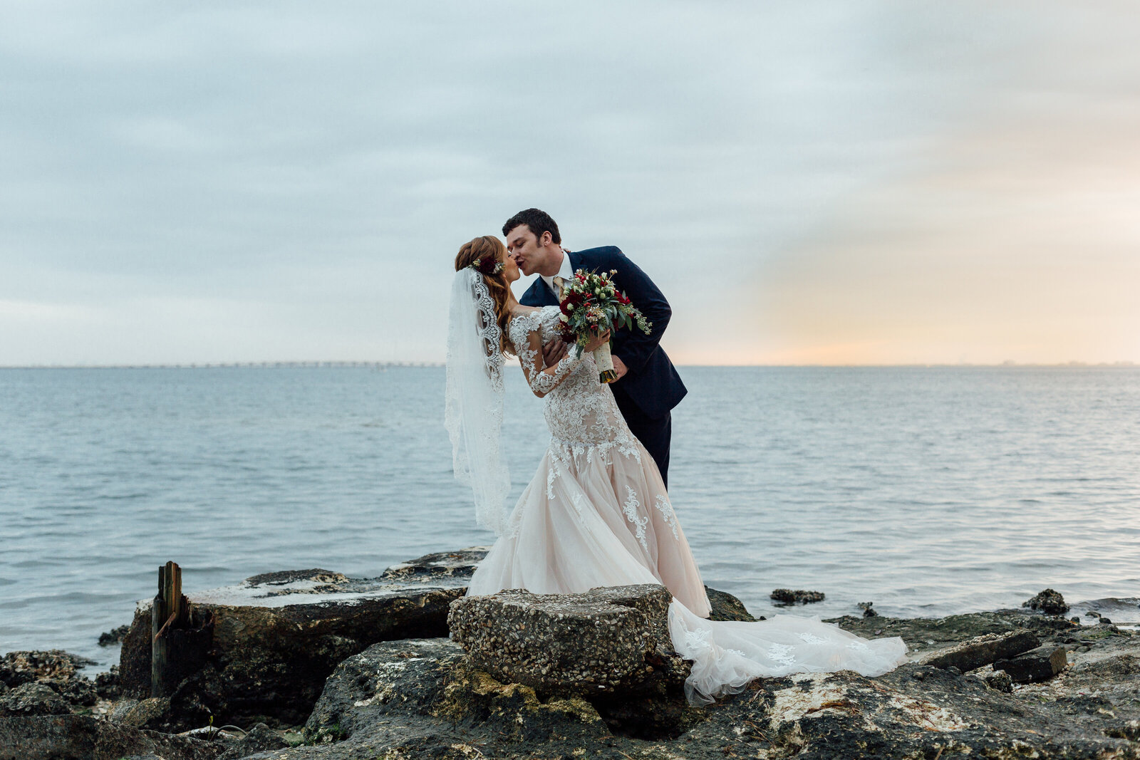 couple-kissing-on-rocks-photo-at-florida-beach-iris-and-urchin-ryley
