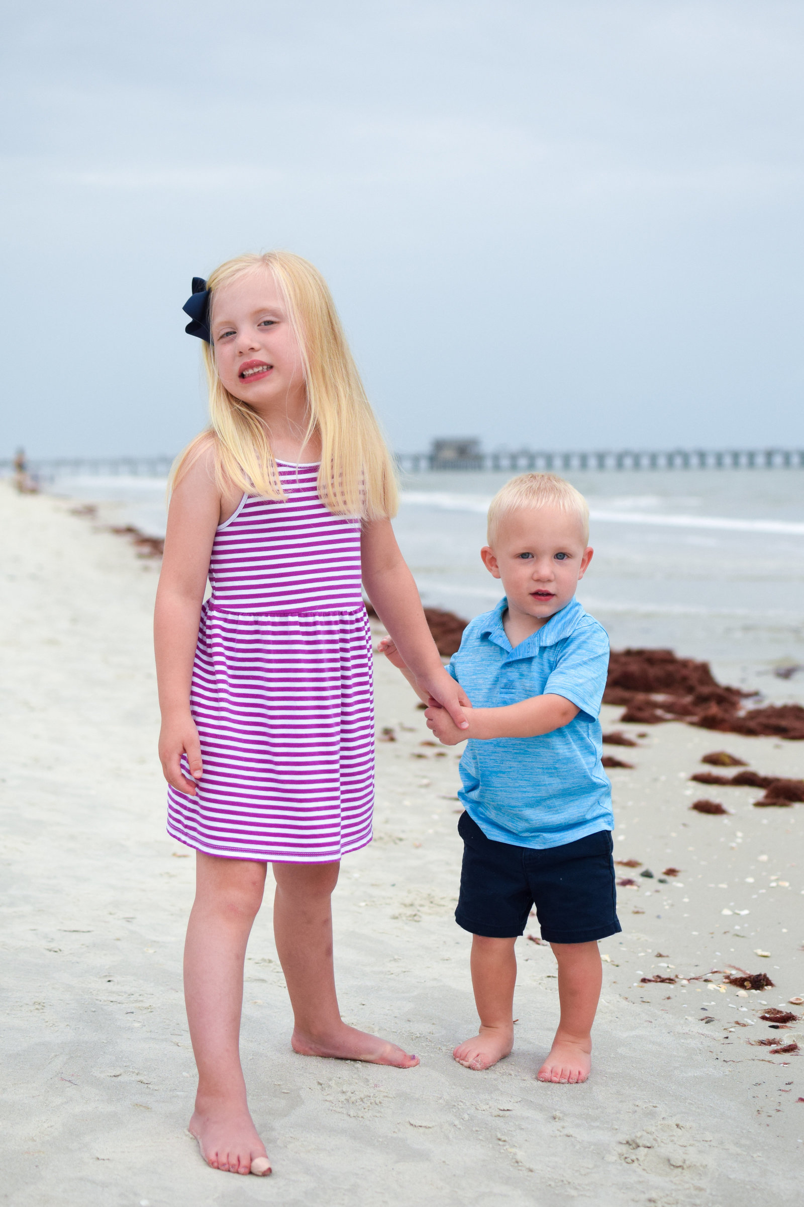 Siblings beach pier Naples Florida