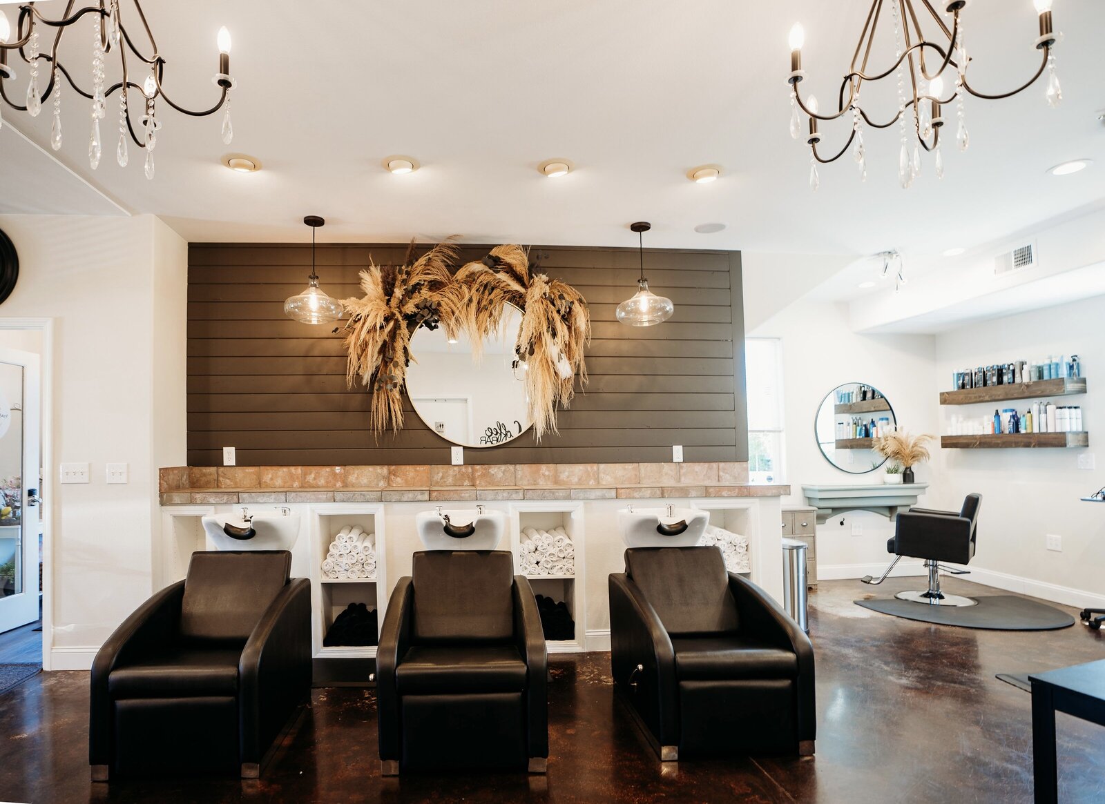 Interior of Maven + Grace Salon in McMinnville, Oregon, with modern shampoo stations and ambient lighting