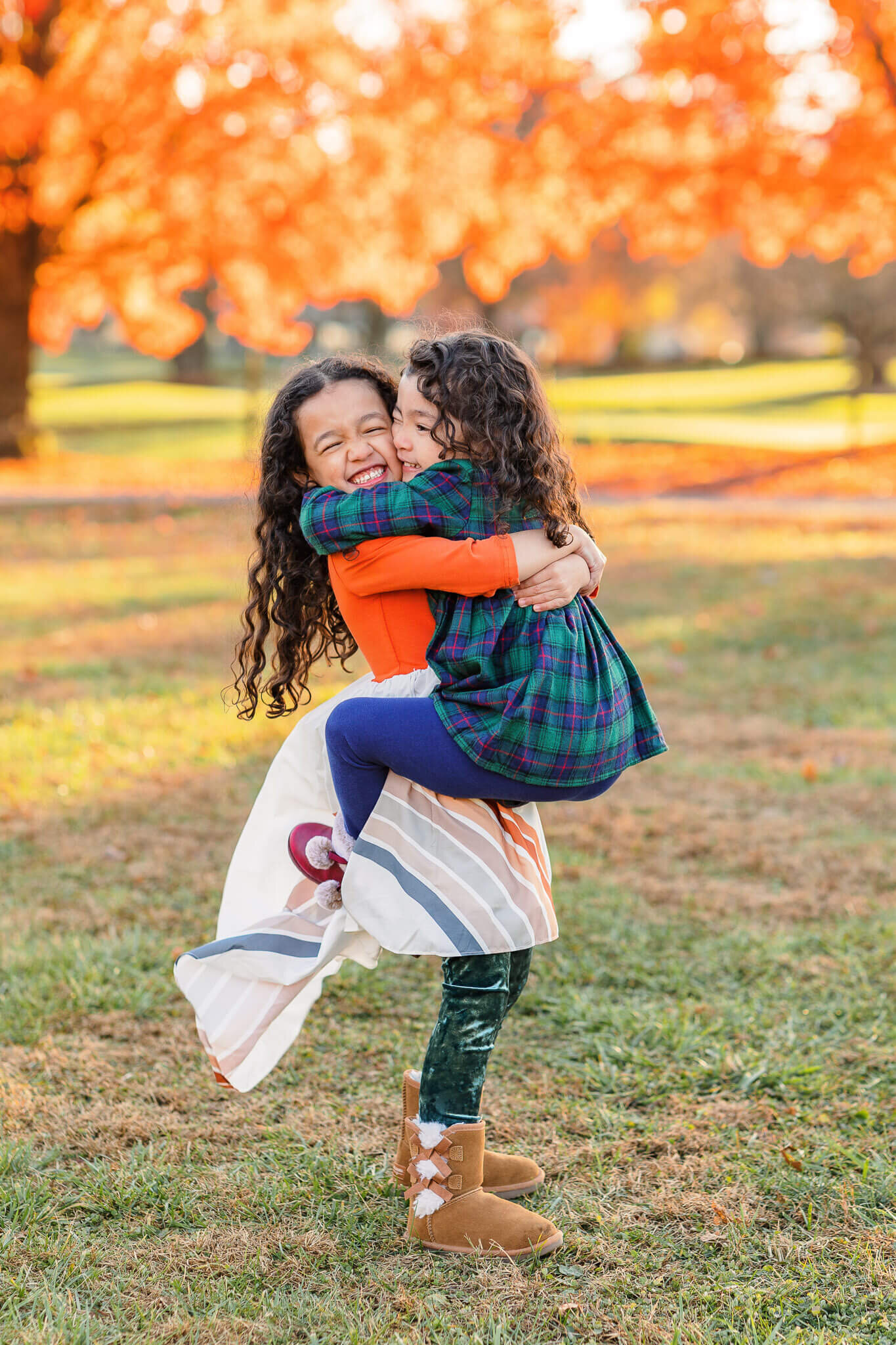 A big sister holding her little sister