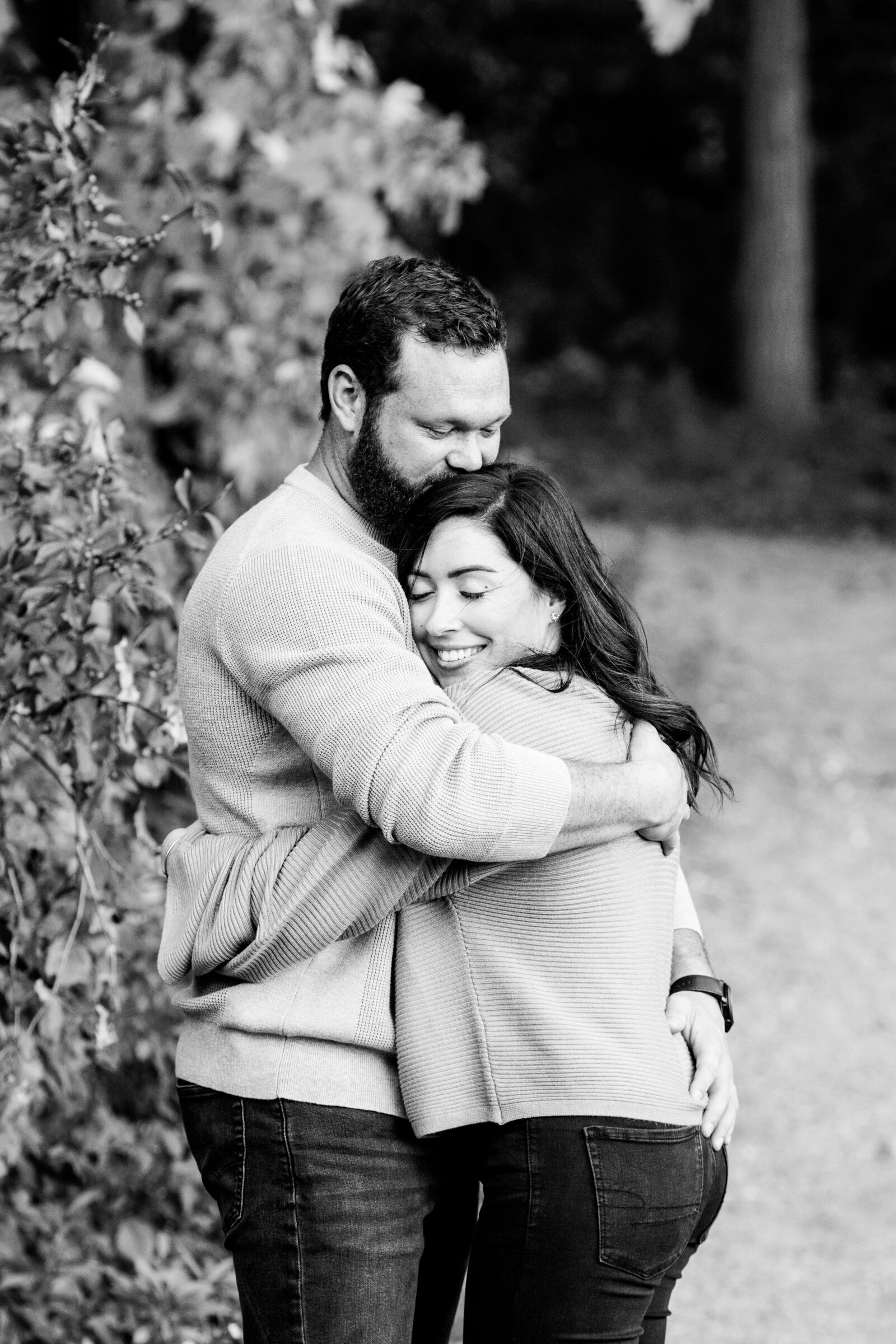 Couple hugging during engagement session.