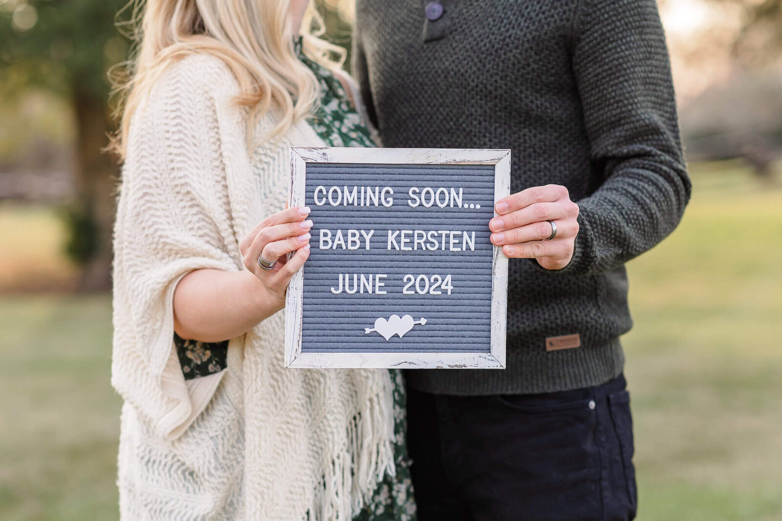 A close-up of a sign announcing a pregnancy.